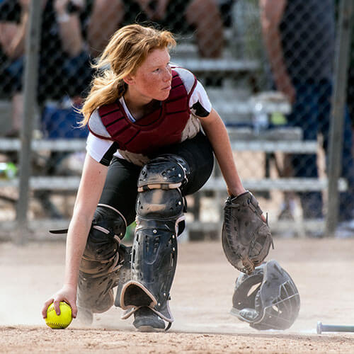 young female softball catcher wearing soft ball athletic gear nashville illinois